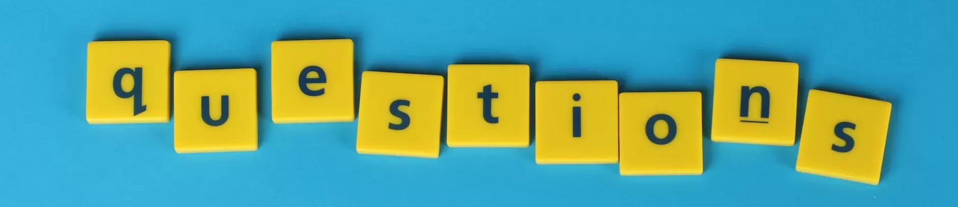 yellow letter tiles on blue background